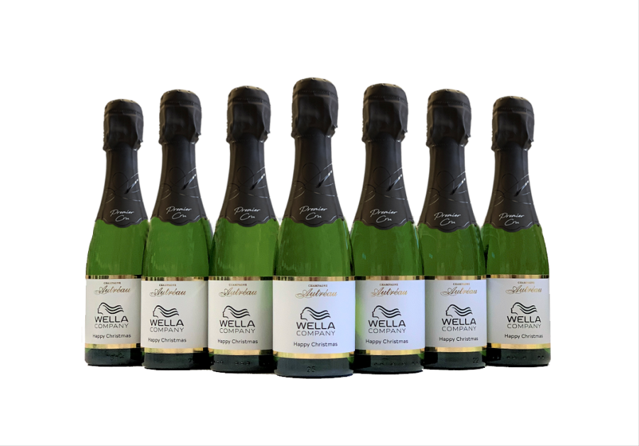 7 bottles of personalised mini champagne with personalised labels